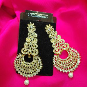 Golden earrings with diamond cuts for added sparkle on a metal base."