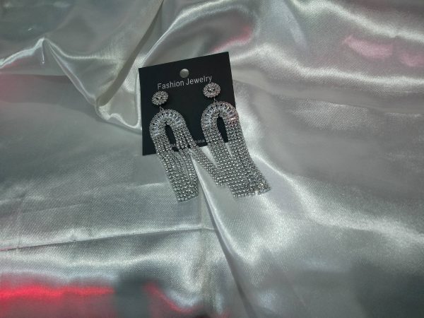 "Silver prom and wedding earrings with long drop design and sparkling details"