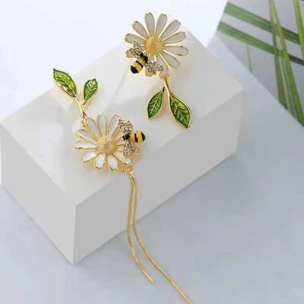 Asymmetric Daisy Tassel Earrings featuring a small bee and daisy design.