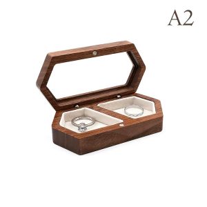 Wooden jewelry box with transparent window for storing rings and earrings.