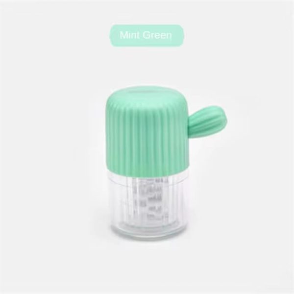 Manual rotation contact lens cleaner in mint green color.